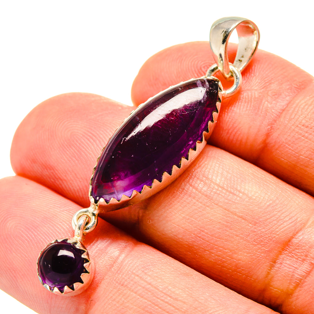 Amethyst pendant with purple teardrop and round stones in sterling silver bezel links
