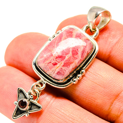 Sterling silver pendant closeup with pink rhodochrosite rectangle and red garnet star