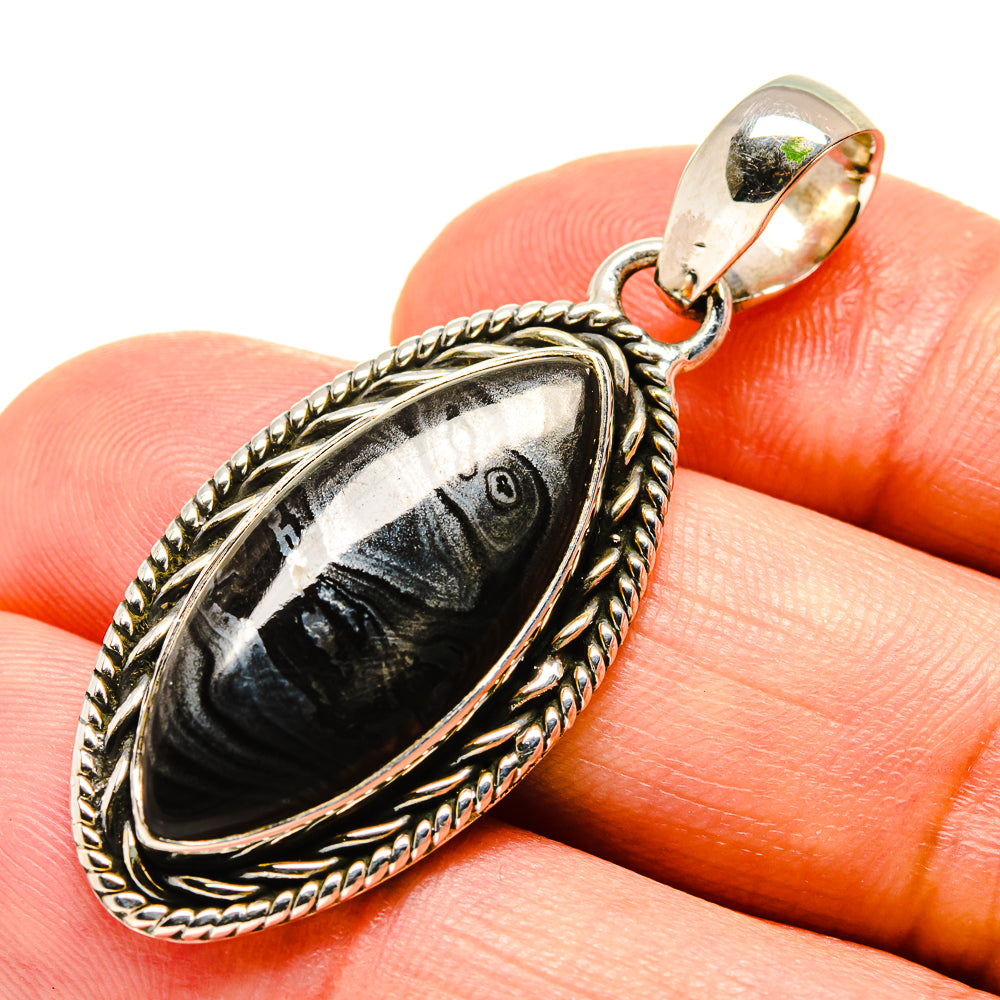 925 sterling silver psilomelane pendant with dark oval stone and rope-edge frame