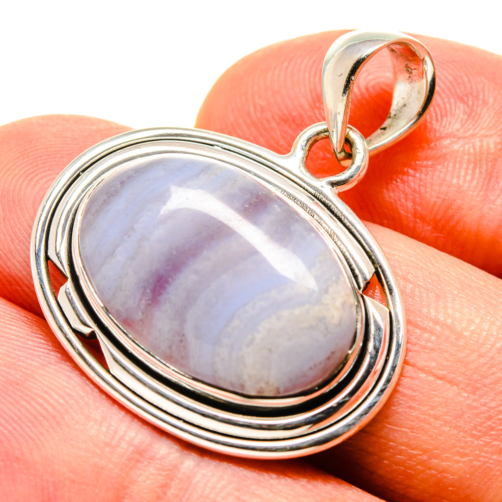 Sterling silver pendant with oval blue lace agate, scalloped bezel and bail loop