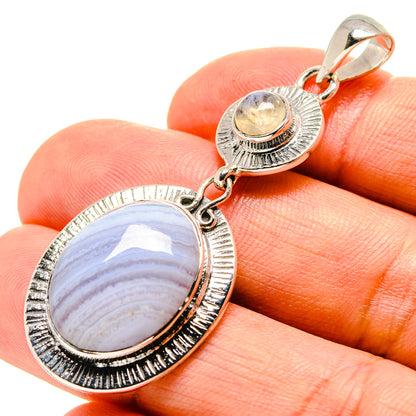Oval moonstone pendant, textured silver bezel and loop bail, sterling silver