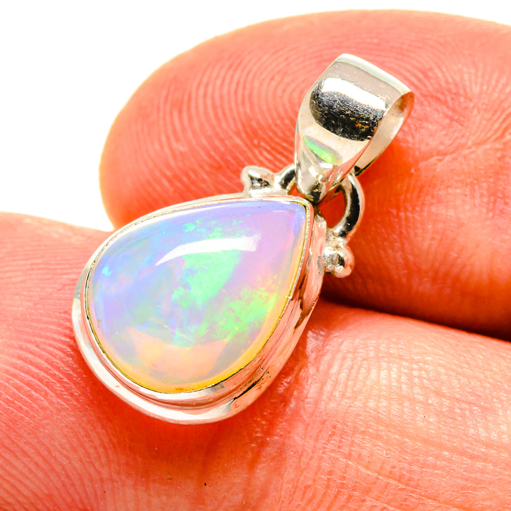 Teardrop opal pendant in polished 925 sterling silver, natural multi-color glow