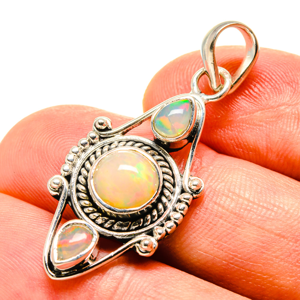 925 sterling silver opal pendant with round opal center and two small oval opal stones