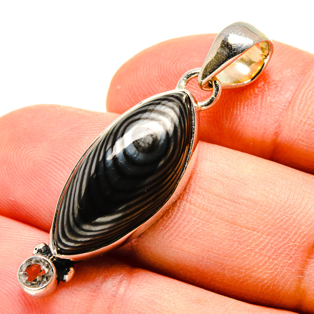 Oval striped black/white gemstone pendant with round clear stone, hinged bail