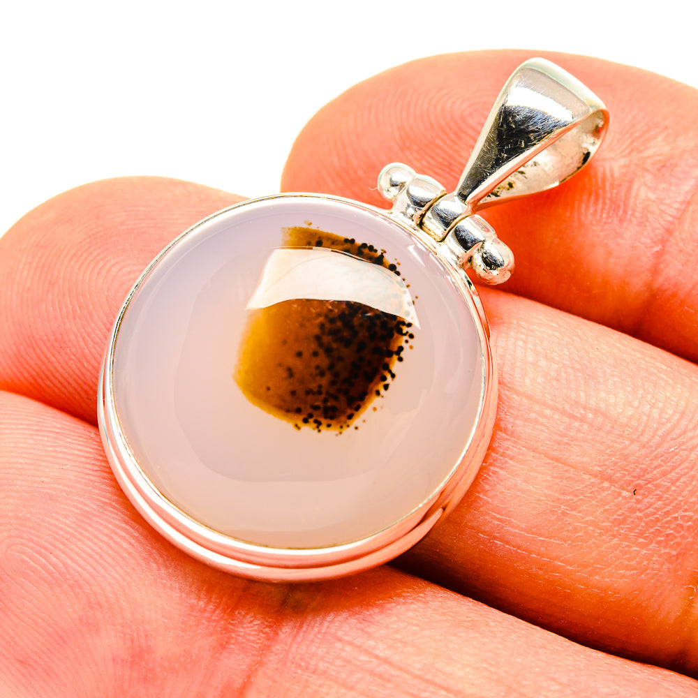 Sterling silver pendant with round Montana agate cabochon, amber-brown, bail