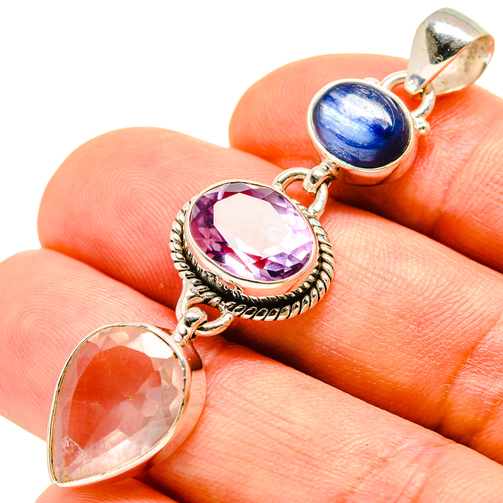 Sterling silver gemstone pendant close-up with blue, purple, and pink oval stones