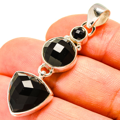 Faceted black onyx pendant in polished 925 sterling silver with three stone bezels