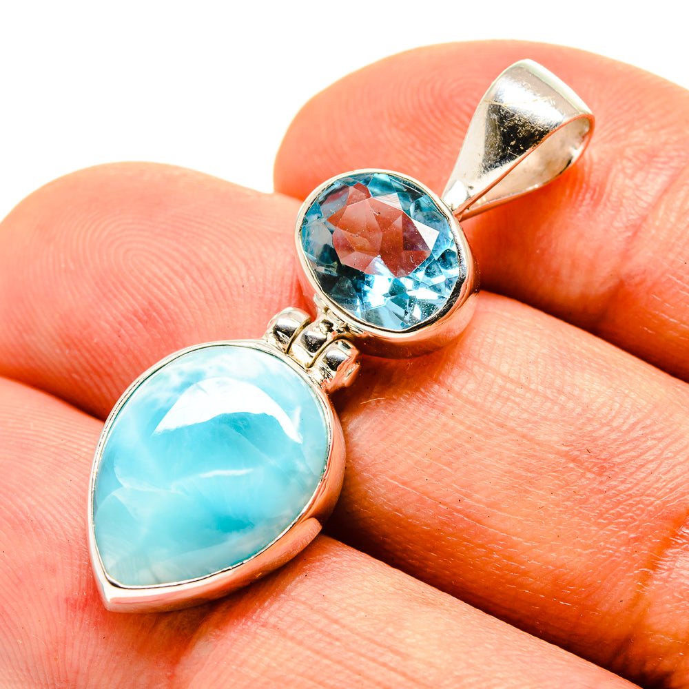 Sterling silver pendant with oval larimar and round blue gemstone in bezel setting