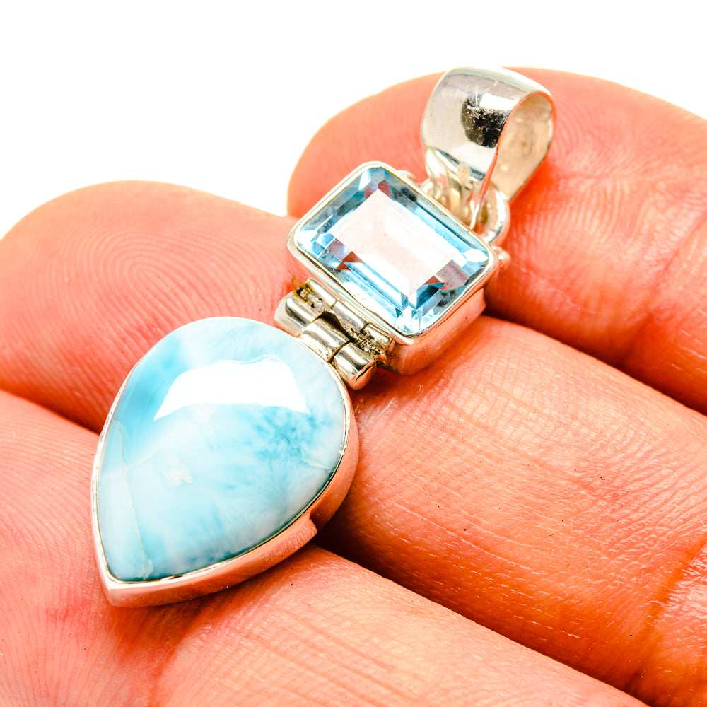 Silver pendant with oval larimar and square blue topaz gemstone, polished bezel