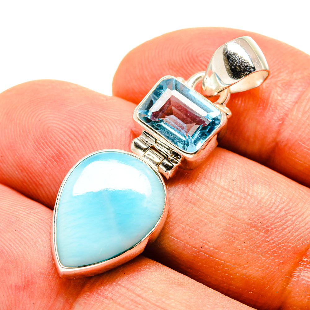 Sterling silver pendant with blue topaz square and light blue teardrop stone