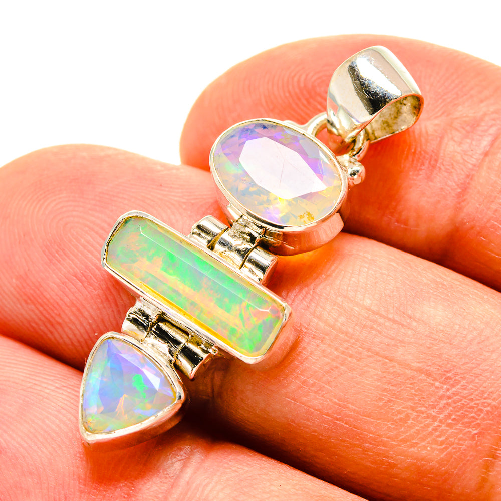 Opal pendant close-up on hand: oval, rectangular, and teardrop stones in 925 silver
