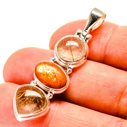 Sterling silver pendant with three oval sunstone and quartz cabochons.