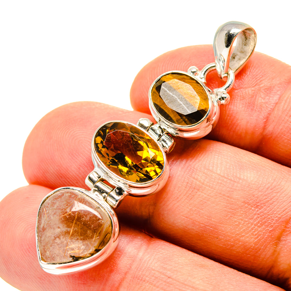 Sterling silver pendant close-up with amber tiger eye, yellow citrine, and clear quartz