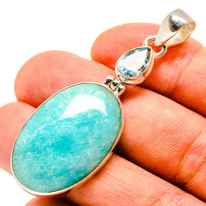 925 sterling silver pendant with oval Amazonite stone and blue topaz accents.