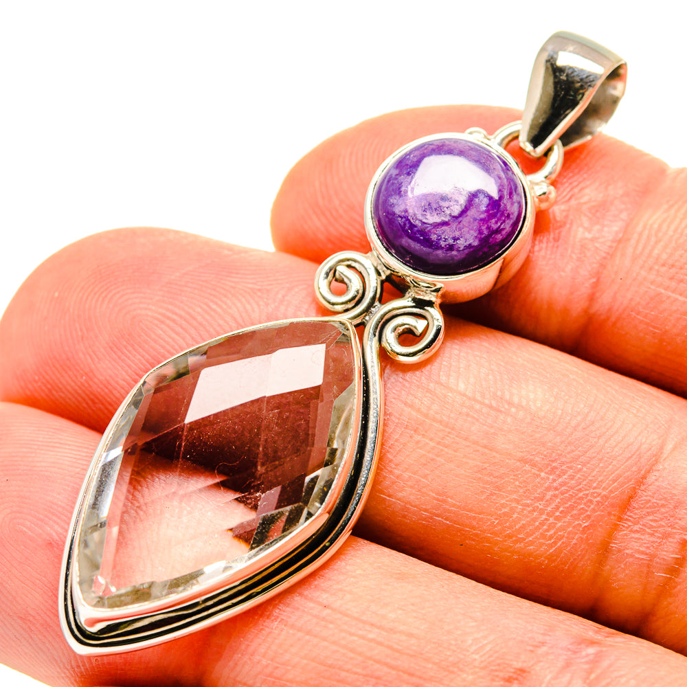 Sterling silver pendant: purple cabochon, clear teardrop stone, loop bail