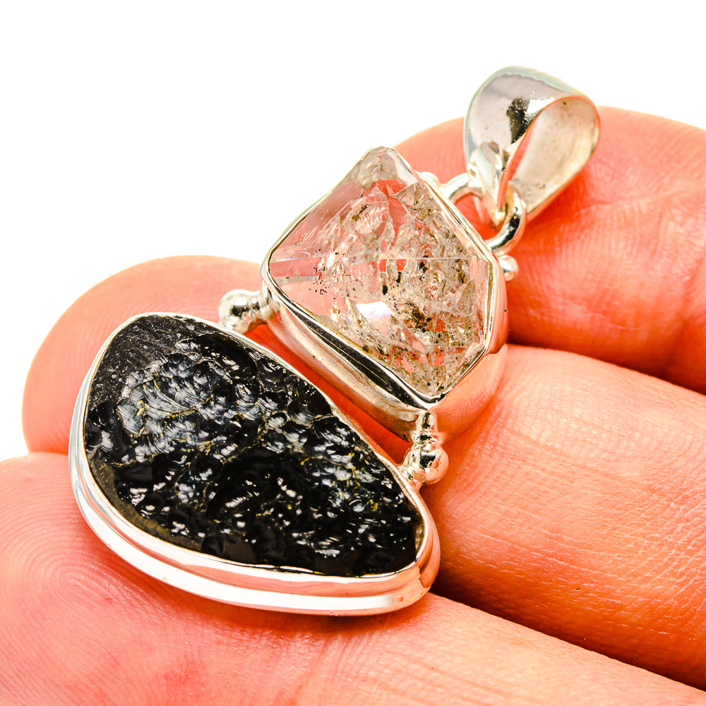 Sterling silver pendant with black tektite and clear diamond-cut crystal