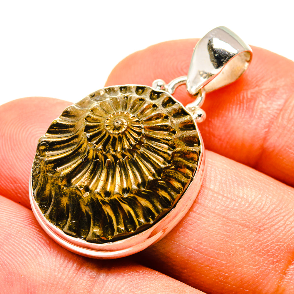 Sterling silver pyrite ammonite pendant, gold-toned disc with dark spiral center