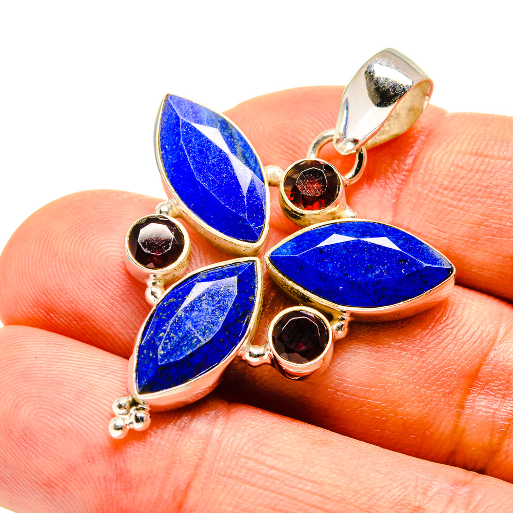 Lapis lazuli and garnet pendant close-up, blue marquise stones with red round garnets in silver