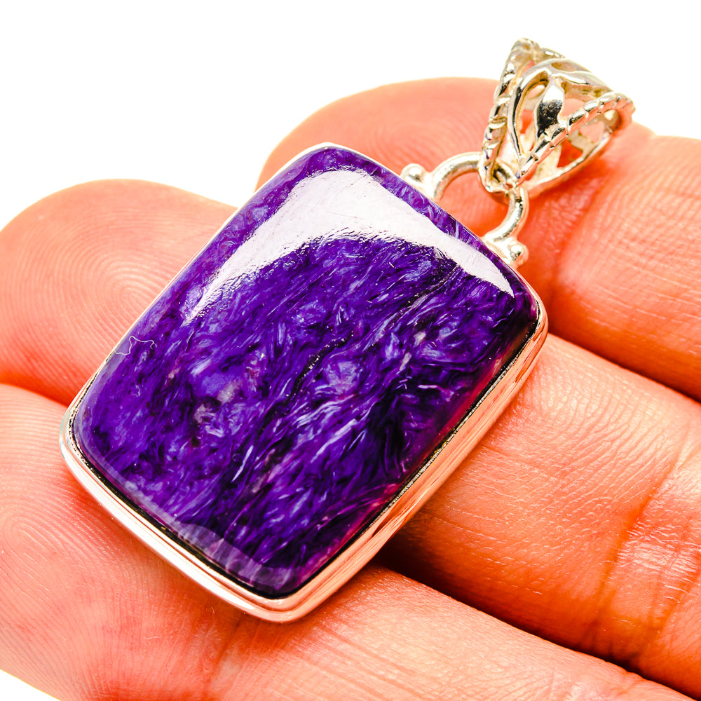 Sterling silver pendant with purple rectangular charoite cabochon and textured bail