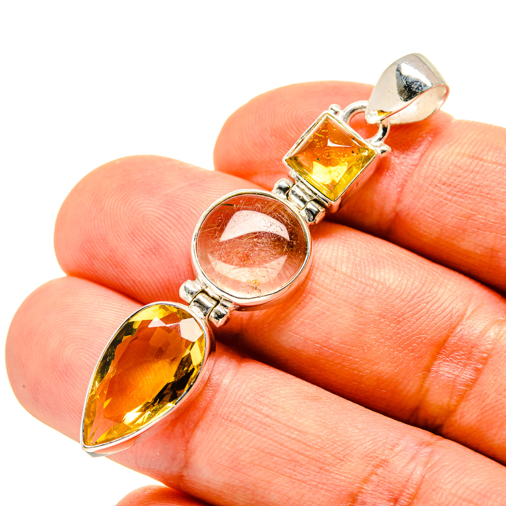 Sterling silver pendant with square yellow citrine, round white stone, and pear citrine