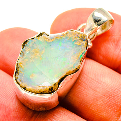 Sterling silver rough opal pendant, turquoise-green opal with gold-toned bezel