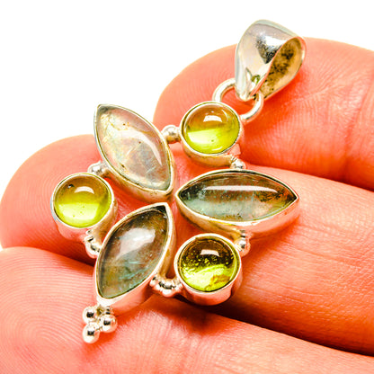 Sterling silver gemstone pendant with prong-set round green and oval opalescent stones