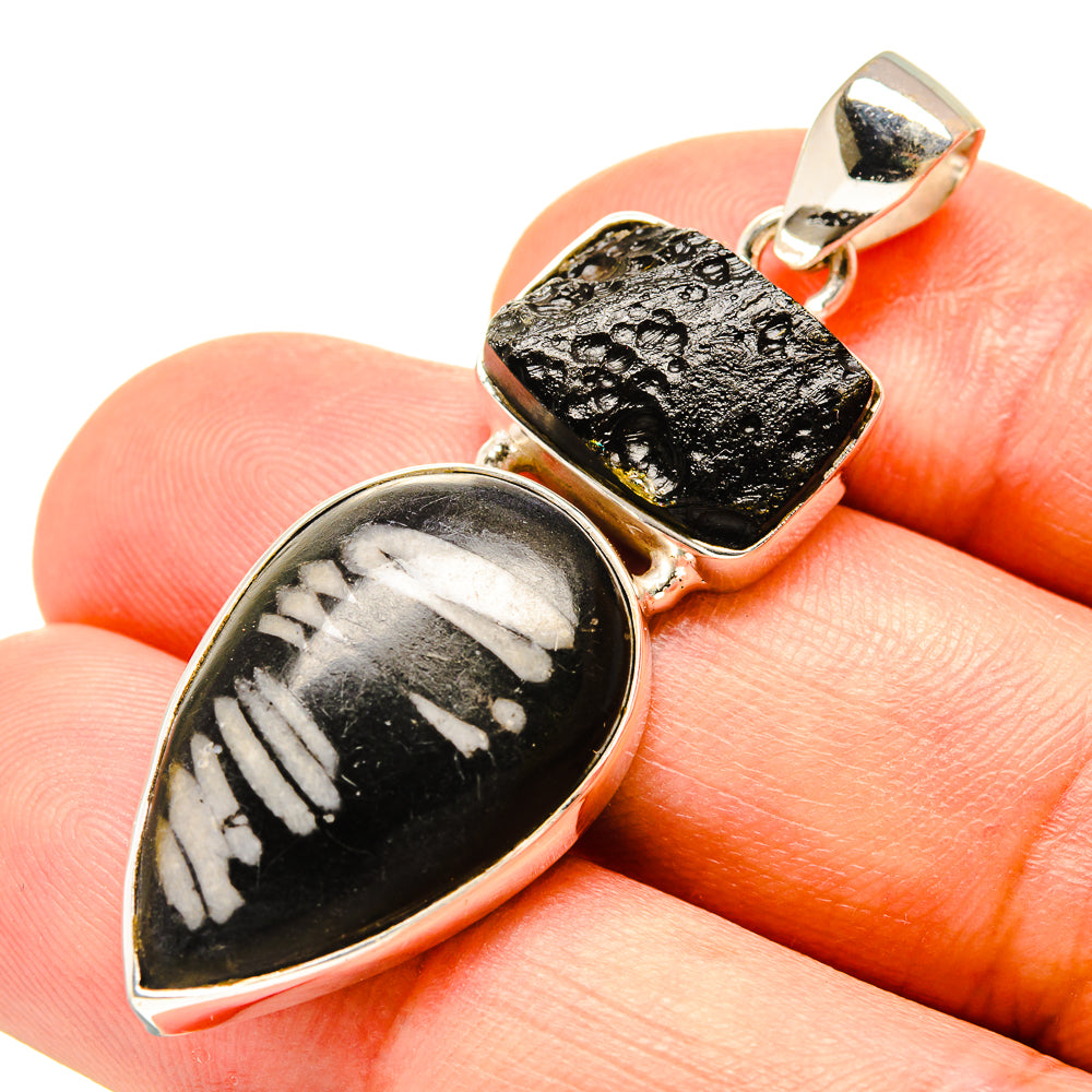 Sterling silver pendant with tektite-style black teardrop stone and golden top accent