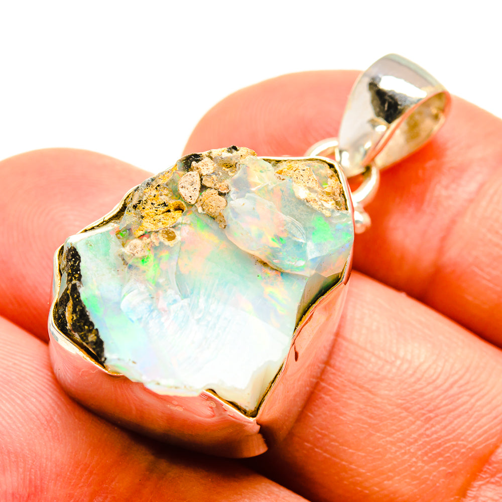Rough opal pendant in 925 sterling silver bezel, iridescent pale green and cream