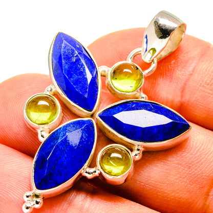 Lapis and peridot butterfly pendant close-up with blue teardrop stones and green round accents
