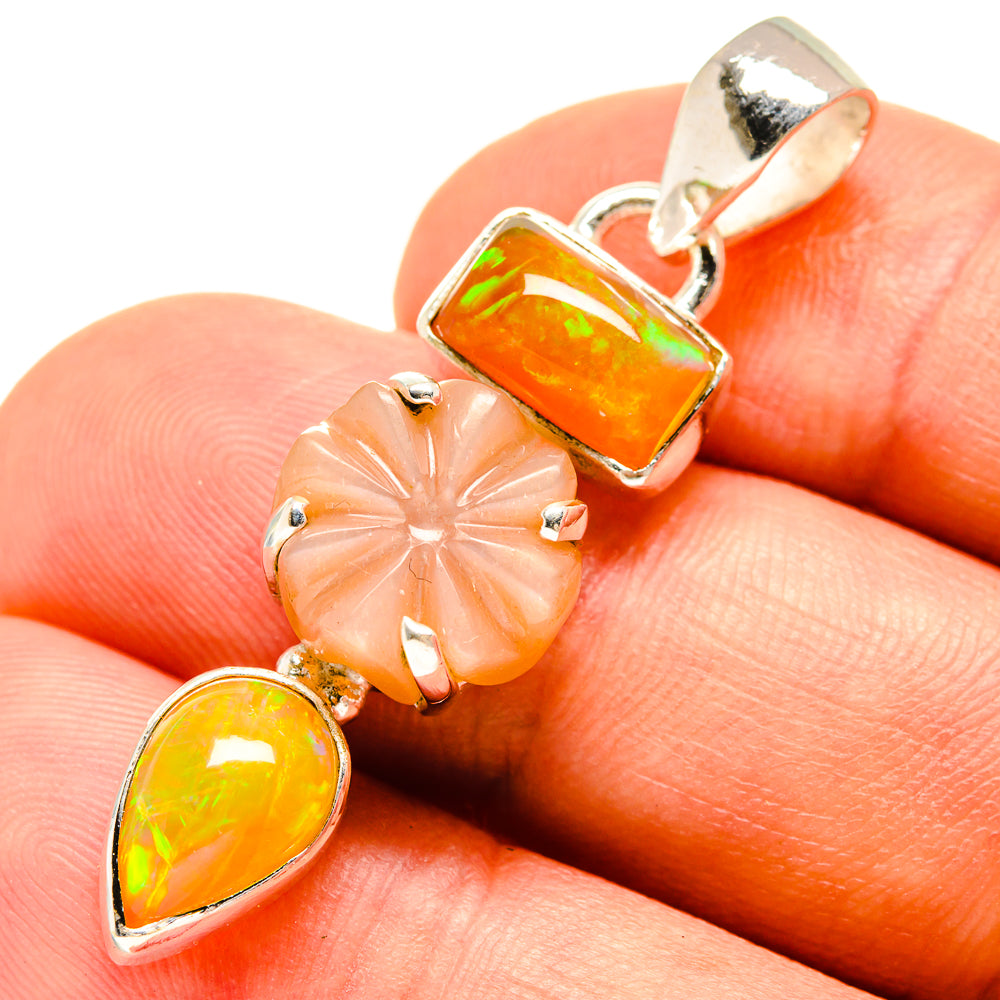 Sterling silver pendant with orange opal teardrop and peach flower cut stones