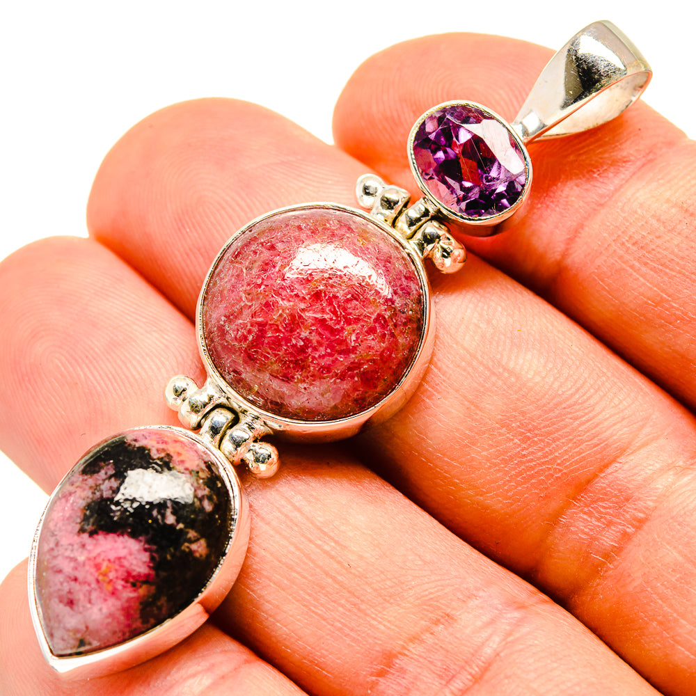 Sterling silver pendant with oval purple amethyst and red gemstone cabochons