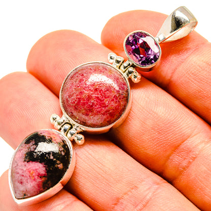 Sterling silver pendant with oval purple amethyst and red gemstone cabochons