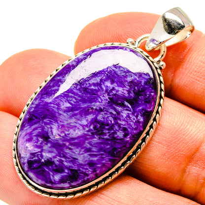 Charoite pendant with purple teardrop stone in polished sterling silver setting