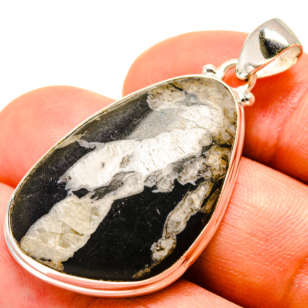 Teardrop stone pendant, speckled black and gray marbled stone in sterling silver bezel