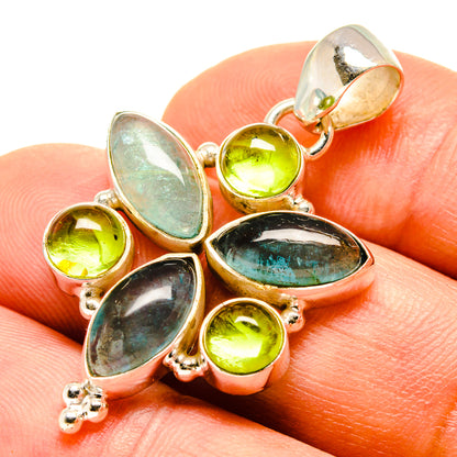 Sterling silver pendant close-up with teal marquise fluorite and lime green peridot accents