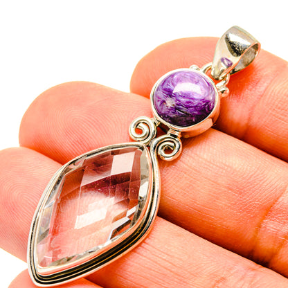 Sterling silver pendant with purple charoite cabochon and faceted clear oval quartz drop