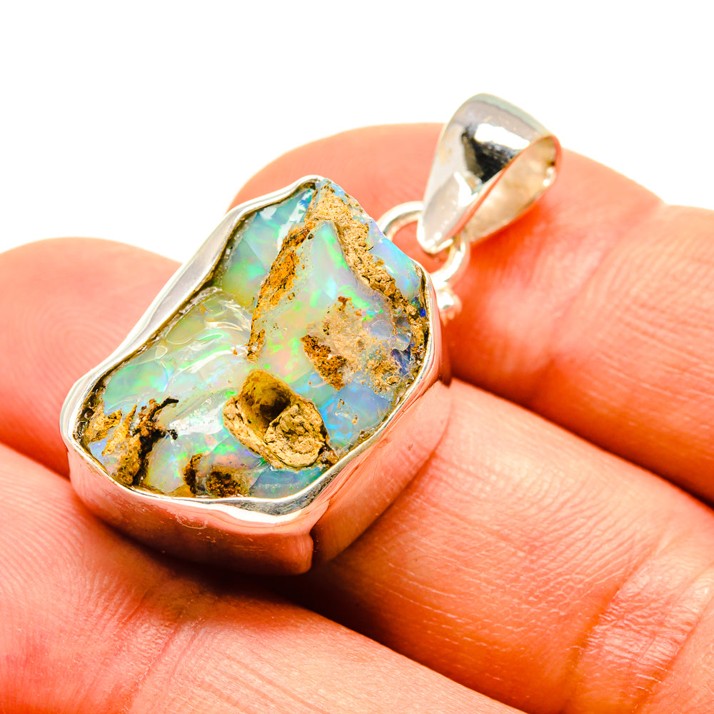 Rough opal pendant, 925 sterling silver bezel; green-blue opal with golden matrix