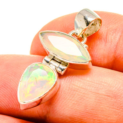 Sterling silver opal pendant with two pear-shaped stones; close-up of bail and bezel