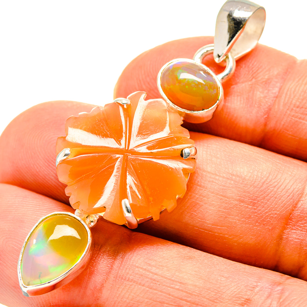 Peach moonstone pendant in silver: orange flower with cabochon and opal teardrop dangle