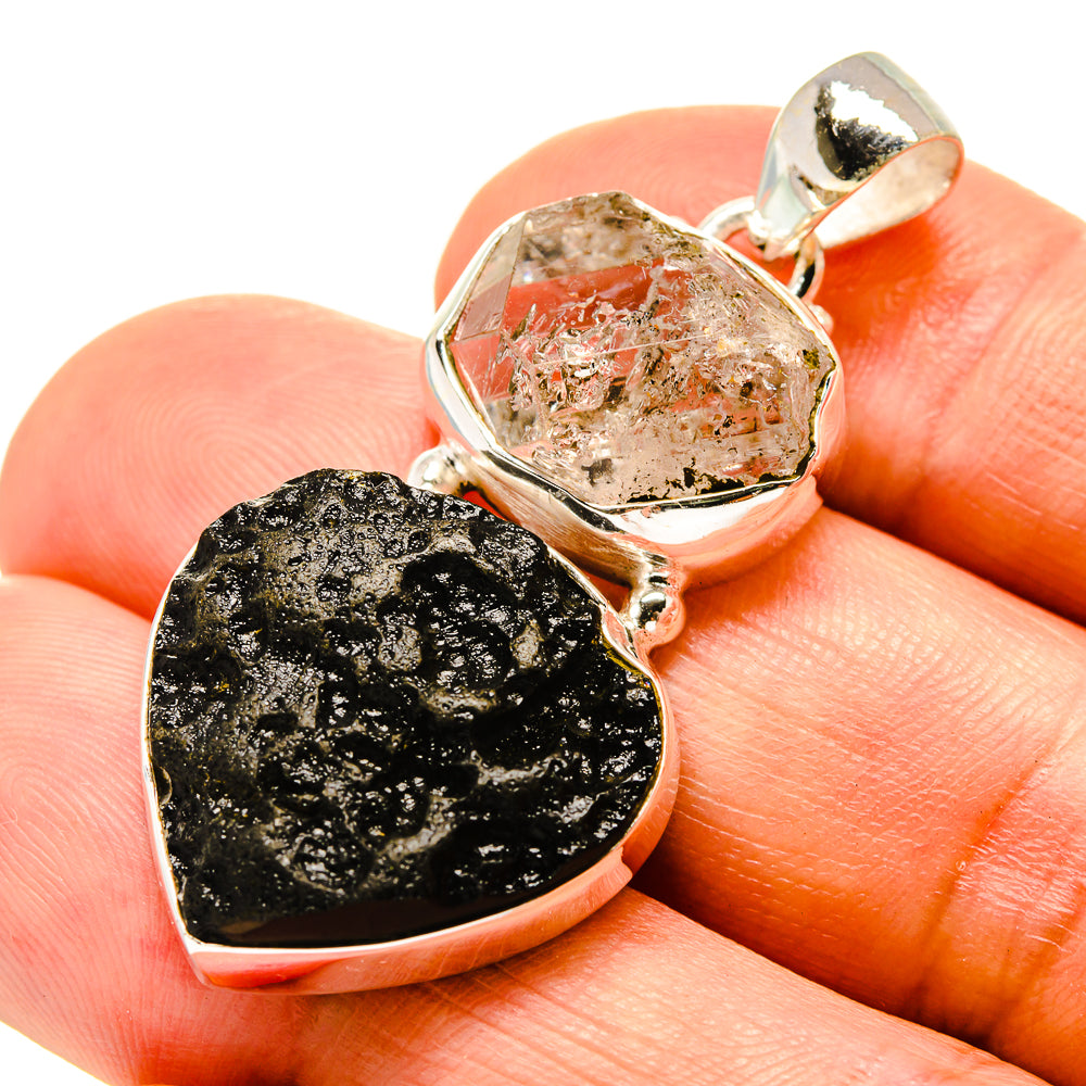 Sterling silver pendant with clear crystal top, black tektite heart, and bail