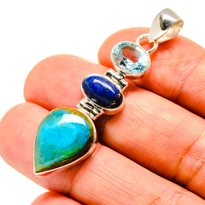 Sterling silver gemstone pendant on hand: teal opal, dark blue lapis, light blue topaz