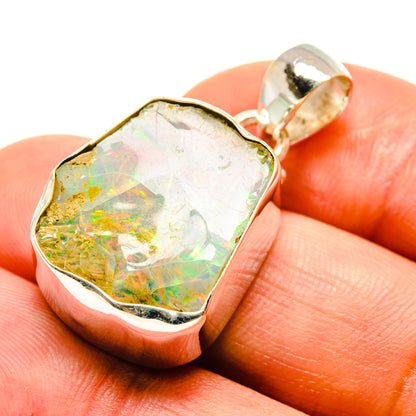 Rough Ethiopian opal pendant closeup, 925 sterling silver bezel, iridescent flashes