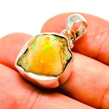 Rough Ethiopian opal pendant in 925 sterling silver with yellow-green stone, close-up.