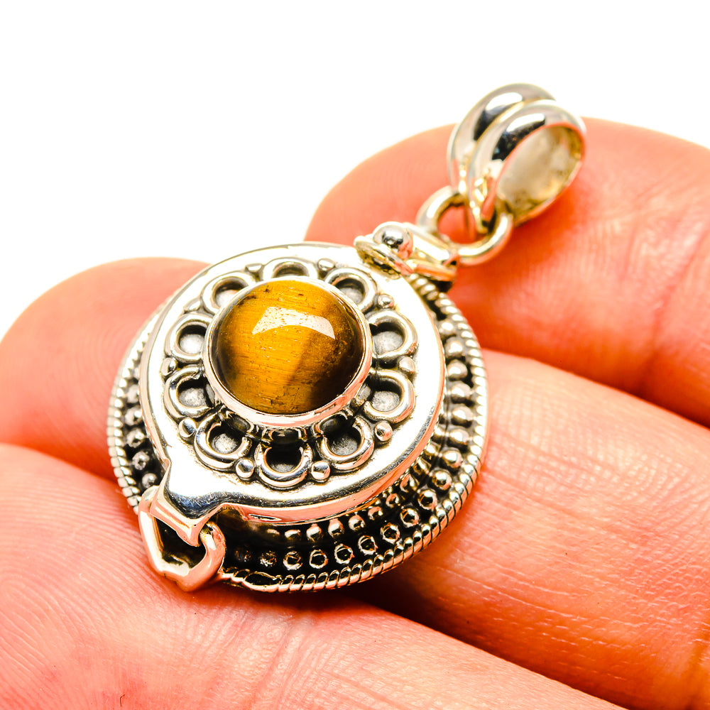 Tiger eye pendant with round yellow-brown cabochon in ornate 925 silver setting