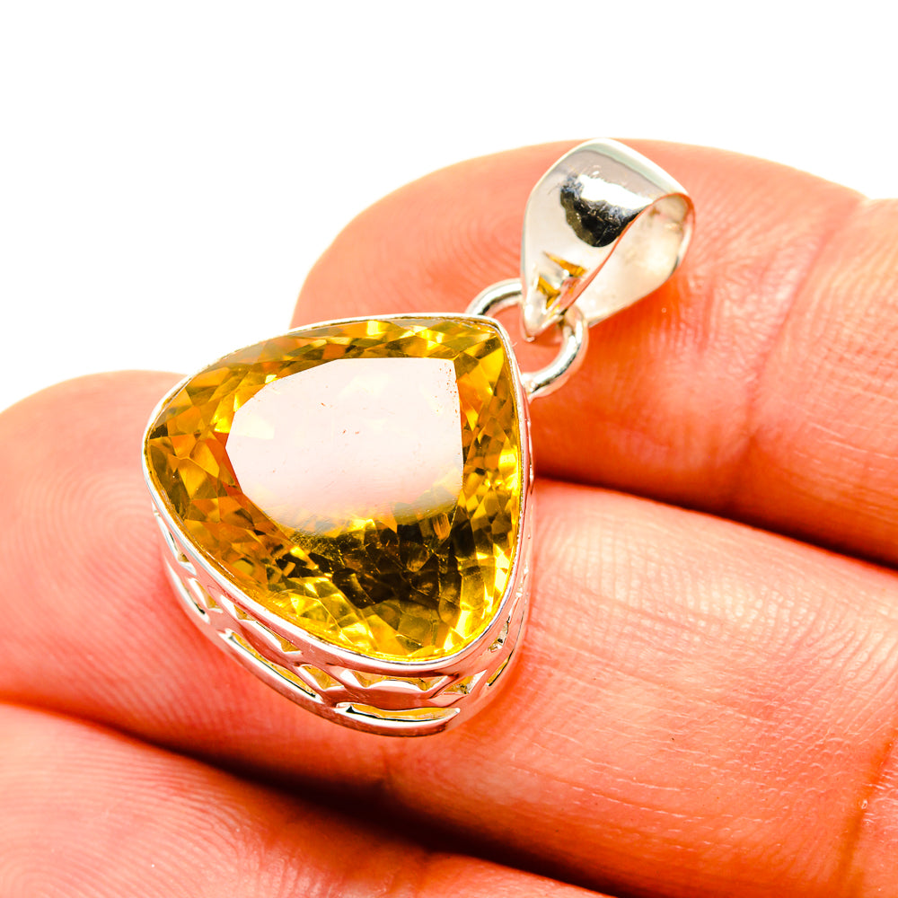 Faceted citrine pendant with pear-shaped yellow gemstone in sterling silver setting
