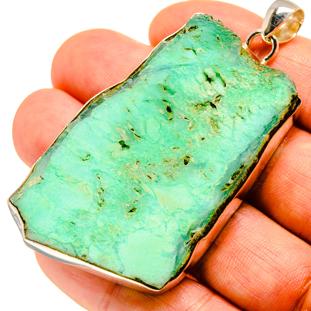 Rough green chrysoprase slice pendant in sterling silver bezel with loop bail