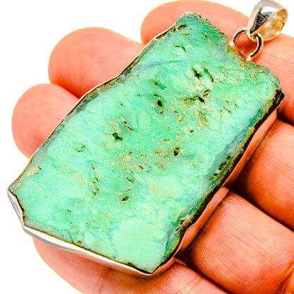 Rough green chrysoprase slice pendant in sterling silver bezel with loop bail