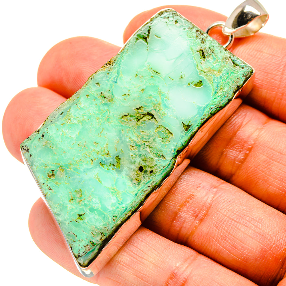 Rough chrysoprase pendant in green with sterling silver bezel and bail, close-up view