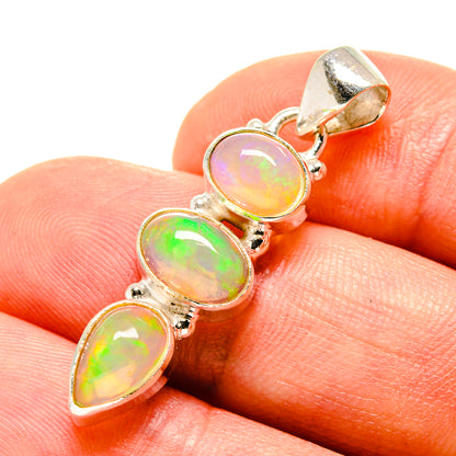 925 sterling silver opal pendant with three iridescent yellow stones, close-up