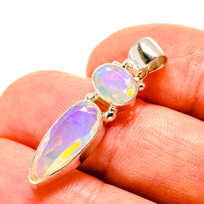 Opal pendant in gold-tone setting with three faceted iridescent stones on bail